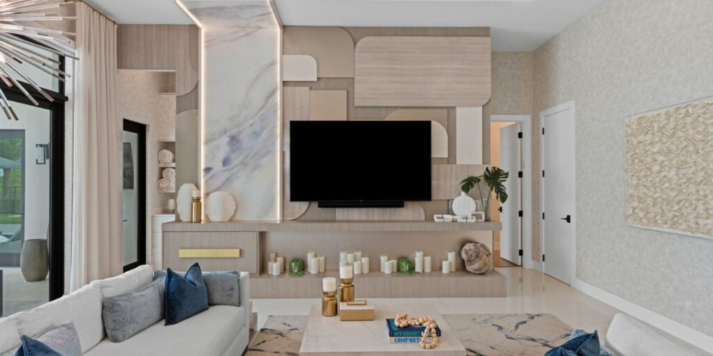 A modern living room with neutral tones and a blend of textures and geometric shapes.