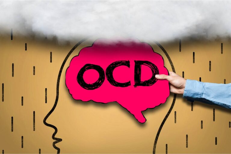 A conceptual image showing a person's profile with a thought bubble containing the letters "OCD," symbolizing obsessive-compulsive disorder, with a hand pointing at it.