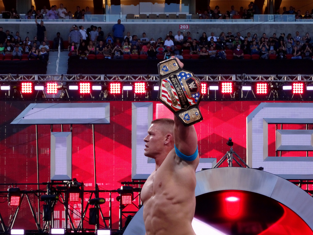 John Cena holding up the United States Champion belt