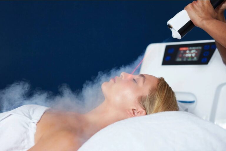 Woman receiving a modern facial treatment with a machine emitting a cooling mist